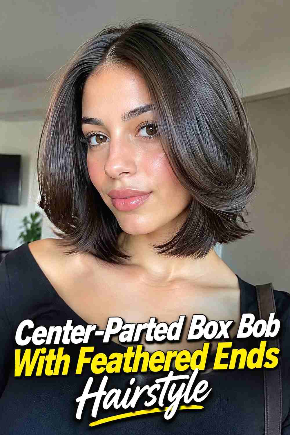 6. Center Parted Box Bob With Feathered Ends Hairstyle