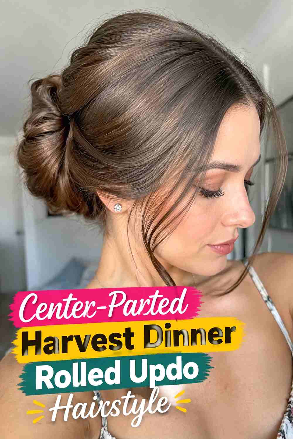9. Center Parted Harvest Dinner Rolled Updo Hairstyle