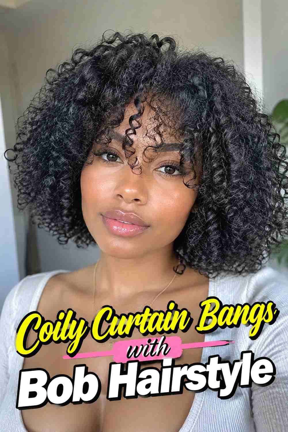 12. Coily Curtain Bangs With Bob Hairstyle