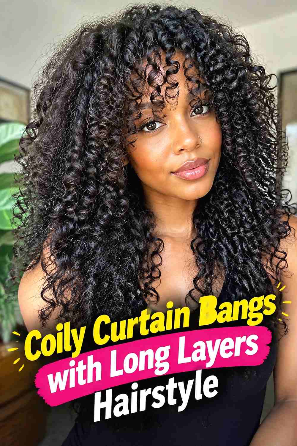 7. Coily Curtain Bangs With Long Layers Hairstyle
