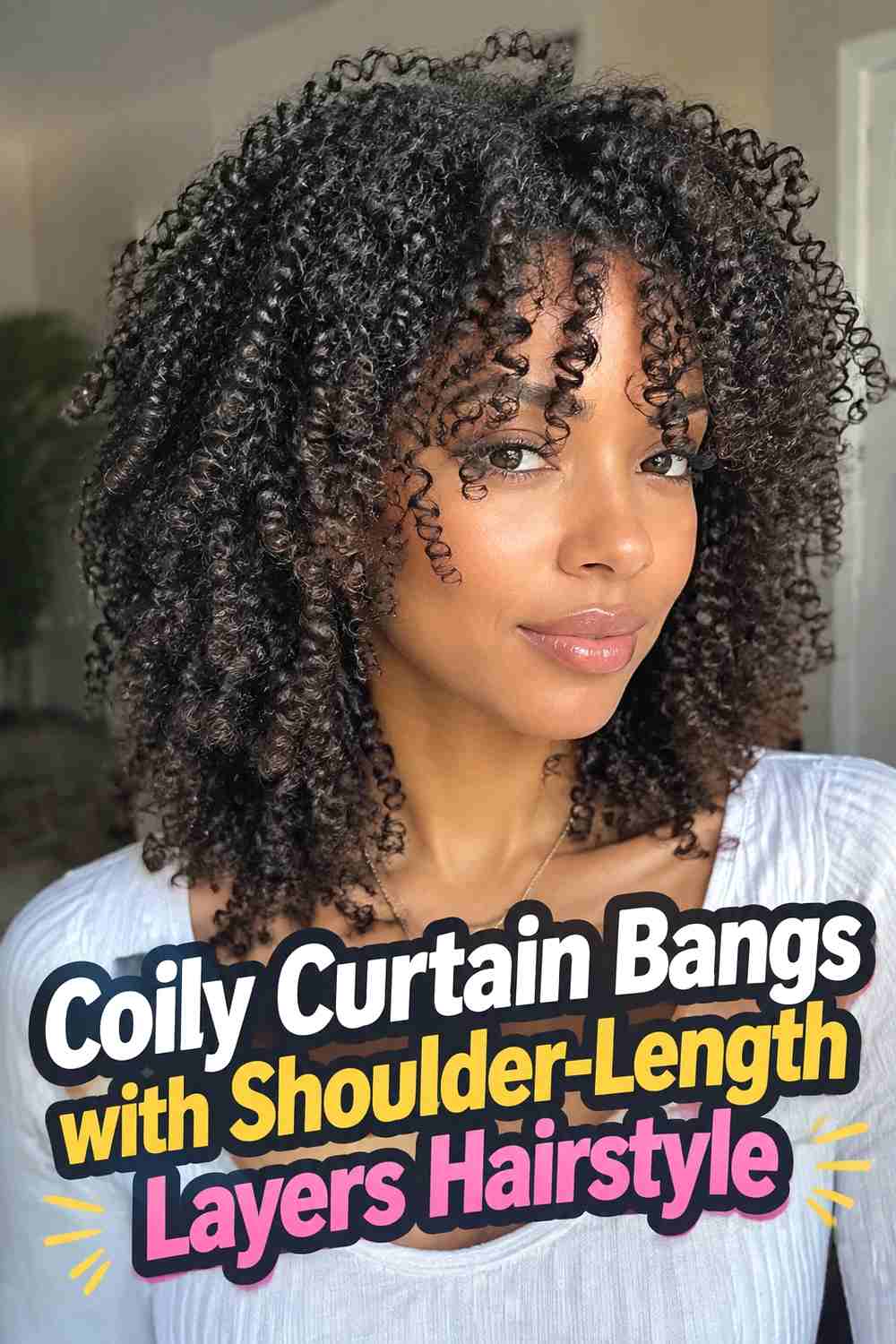 6. Coily Curtain Bangs With Shoulder Length Layers Hairstyle