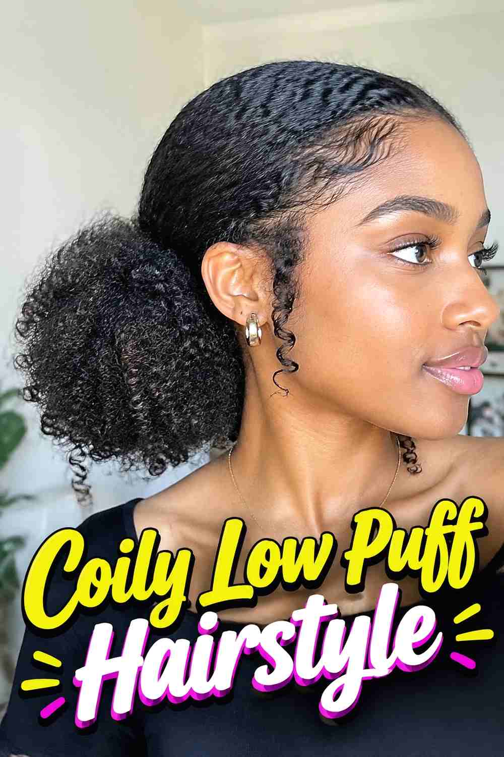 14. Coily Low Puff Hairstyle