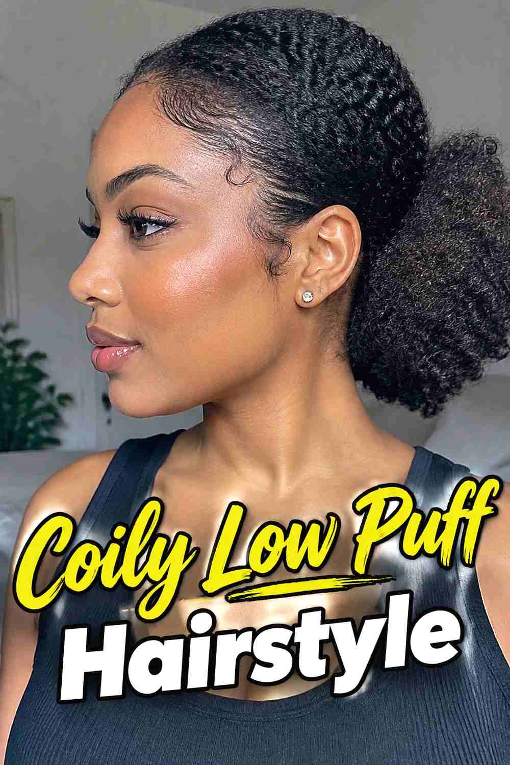 15. Coily Low Puff Hairstyle