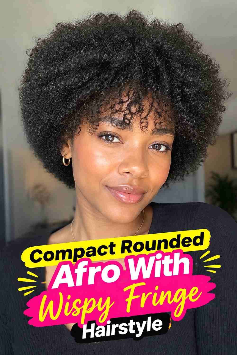 4. Compact Rounded Afro With Wispy Fringe Hairstyle