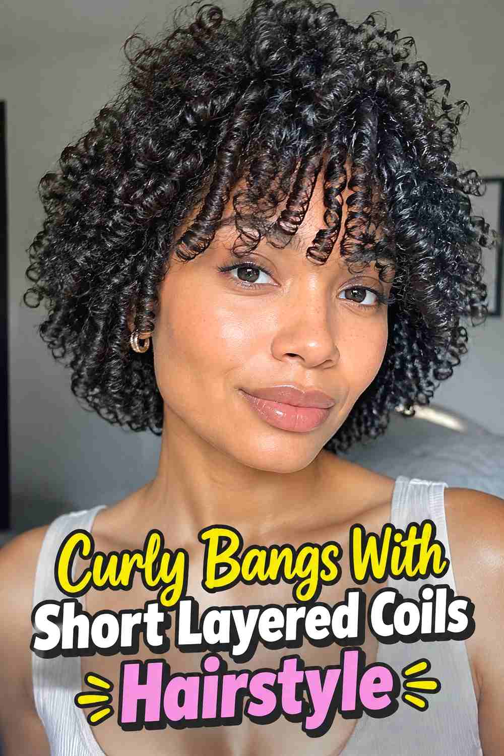 14. Curly Bangs With Short Layered Coils Hairstyle
