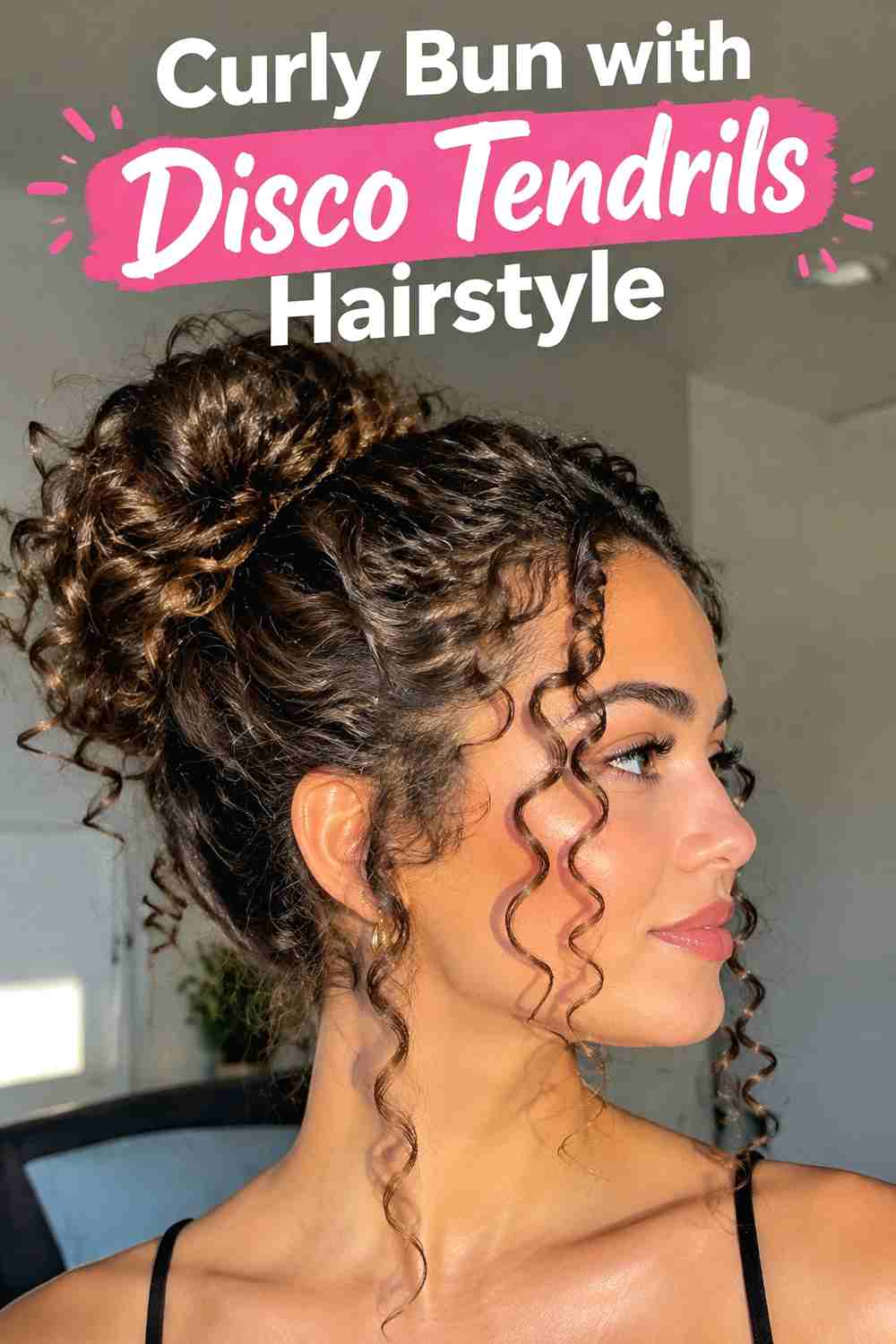 19. Curly Bun With Disco Tendrils Hairstyle