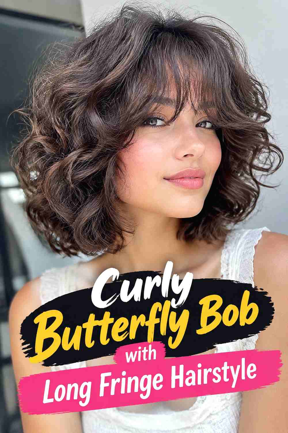 9. Curly Butterfly Bob With Long Fringe Hairstyle