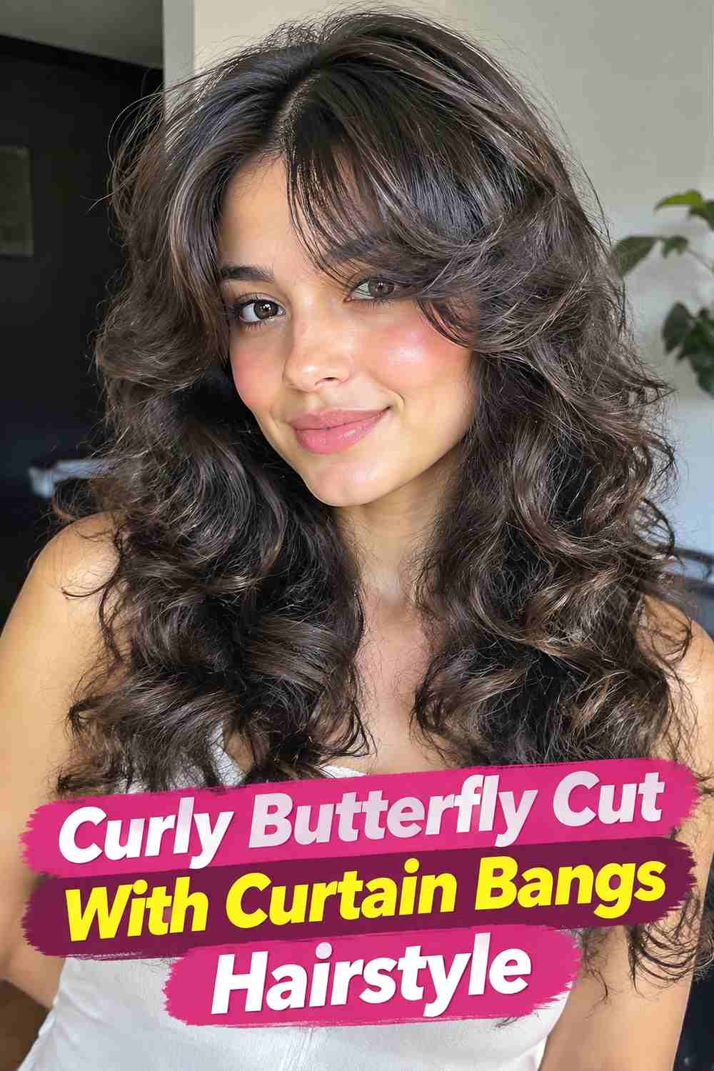 6. Curly Butterfly Cut With Curtain Bangs Hairstyle