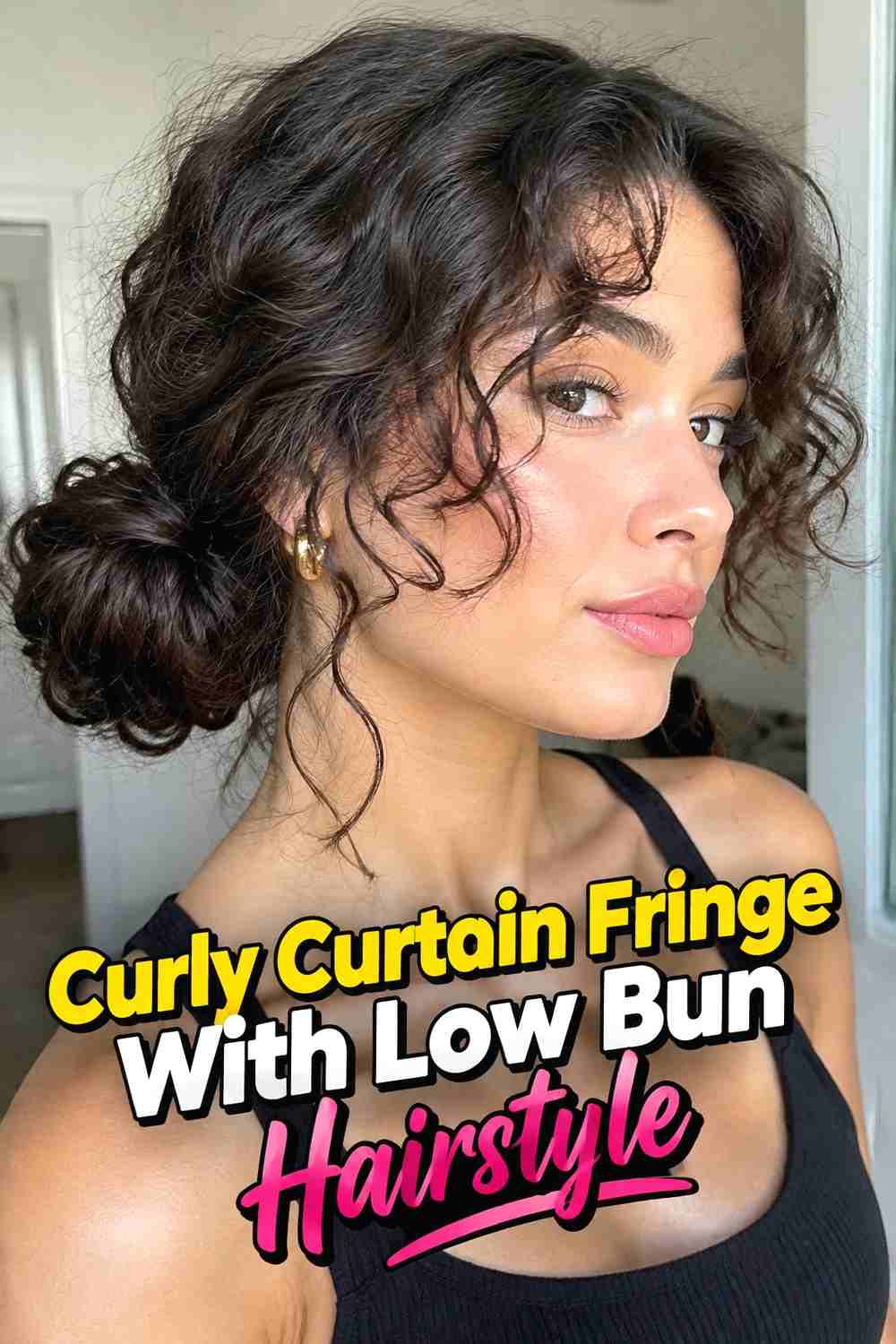 12. Curly Curtain Fringe With Low Bun Hairstyle