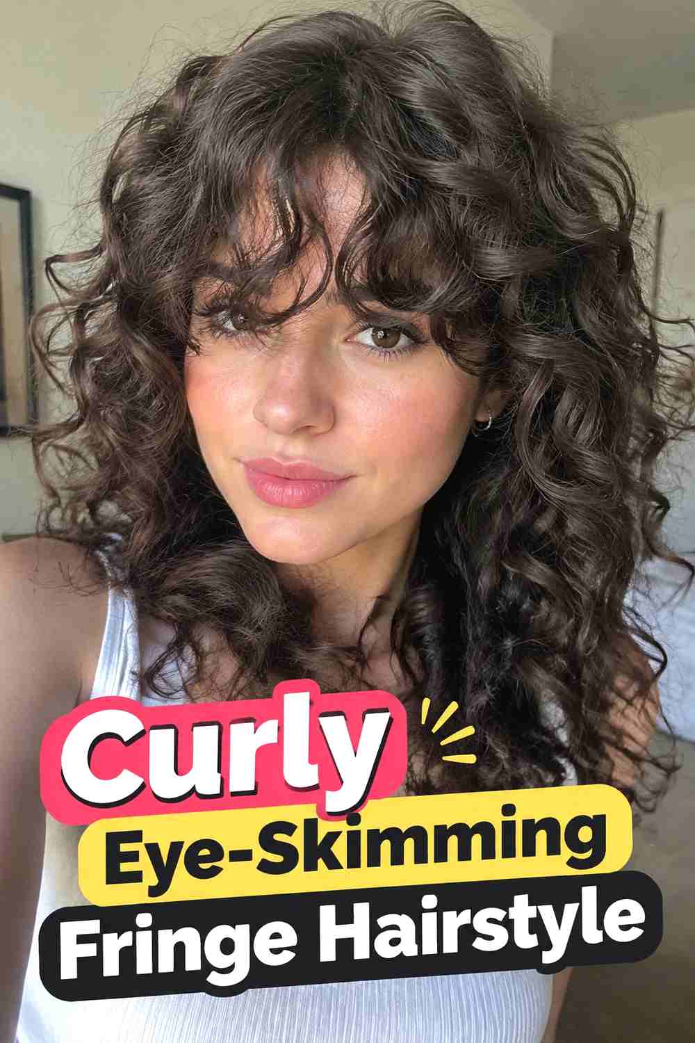 8. Curly Eye Skimming Fringe Hairstyle