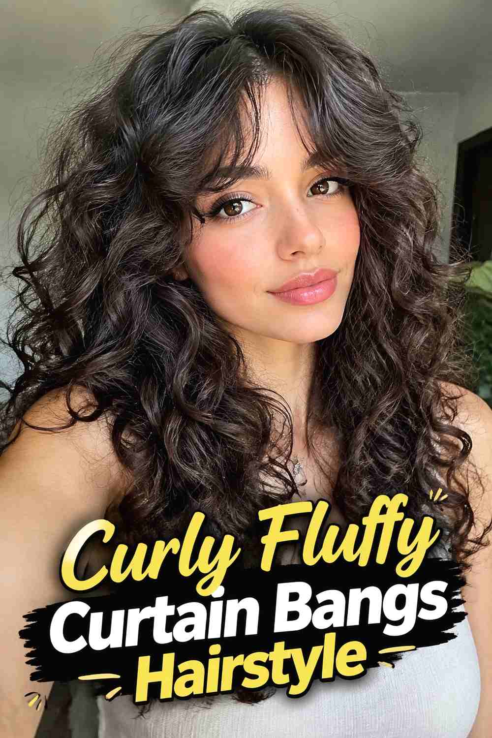 6. Curly Fluffy Curtain Bangs Hairstyle