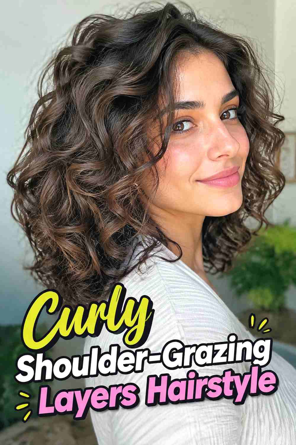 13. Curly Shoulder Grazing Layers Hairstyle