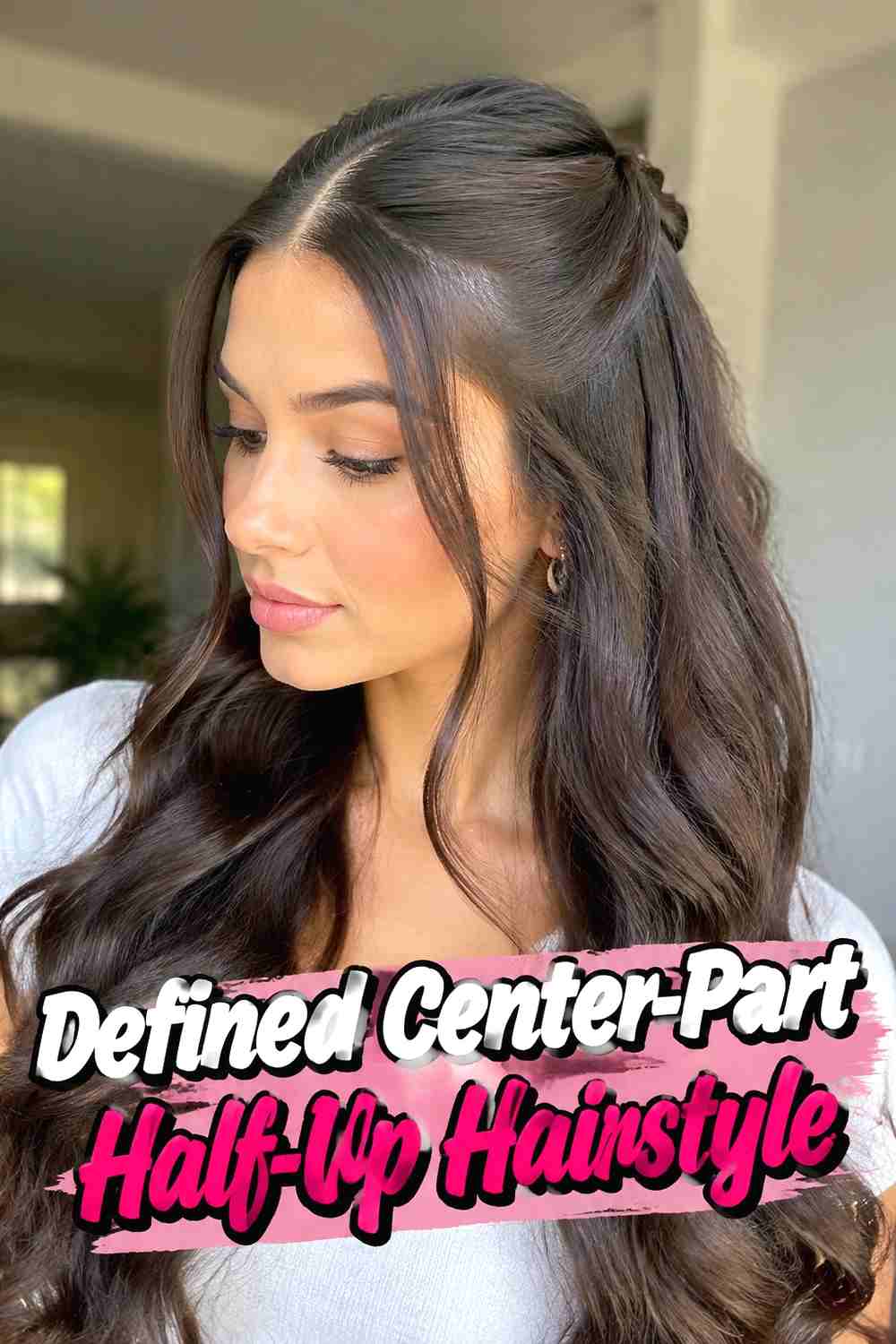 14. Defined Center Part Half Up Hairstyle