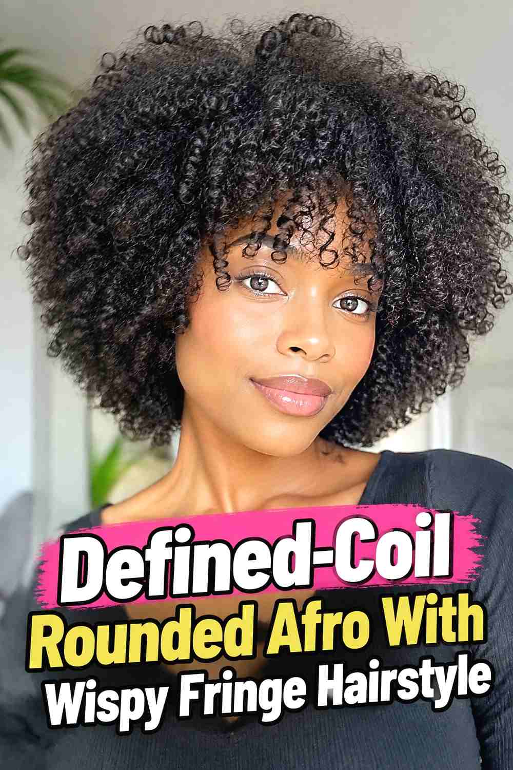 9. Defined Coil Rounded Afro With Wispy Fringe Hairstyle