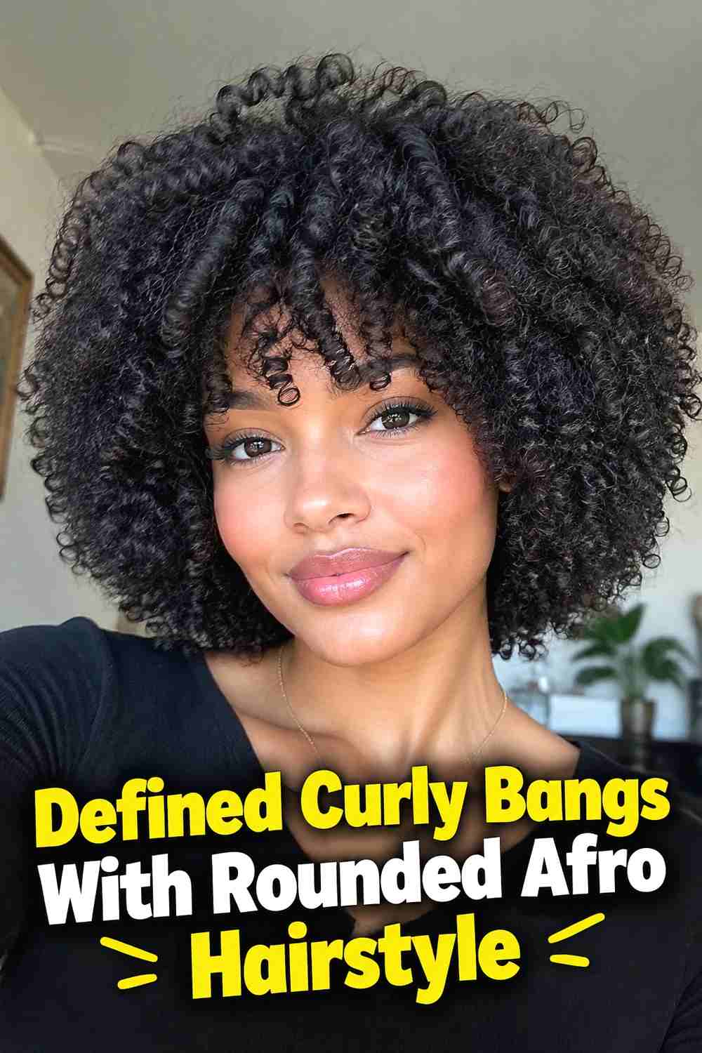 2. Defined Curly Bangs With Rounded Afro Hairstyle