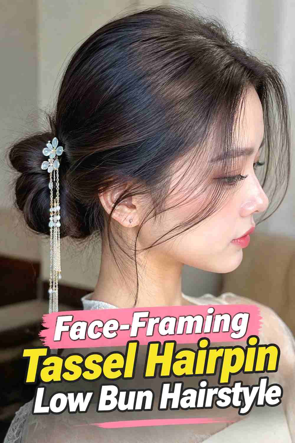 13. Face Framing Tassel Hairpin Low Bun Hairstyle
