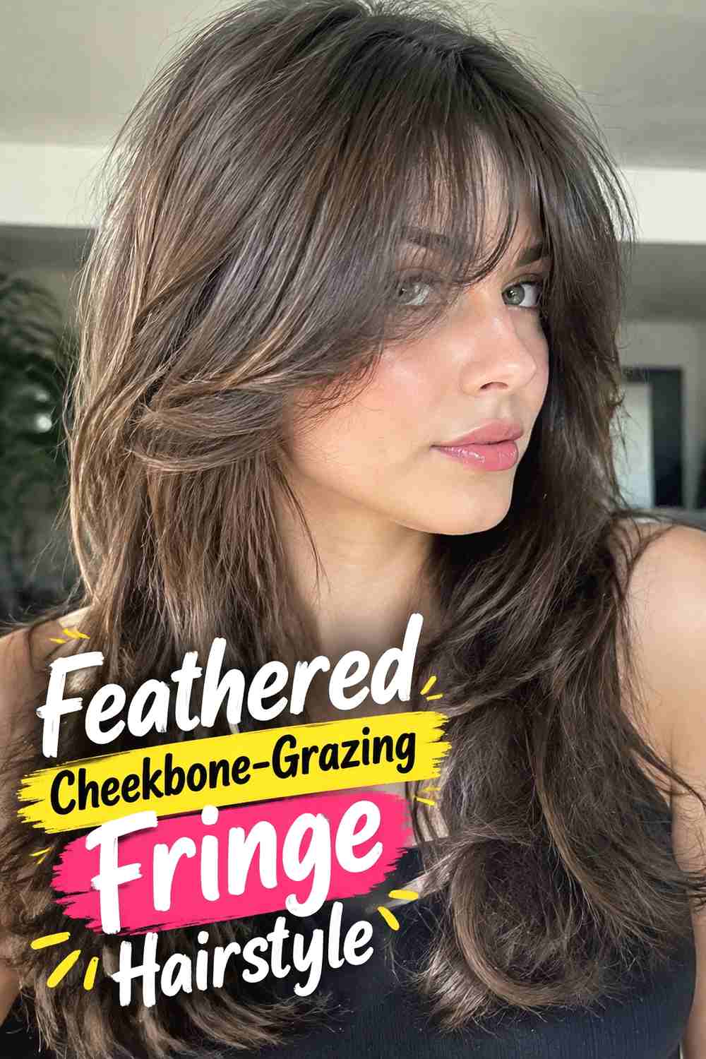 9. Feathered Cheekbone Grazing Fringe Hairstyle