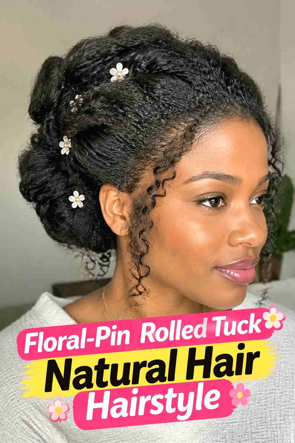 16. Floral Pin Rolled Tuck Natural Hair Hairstyle