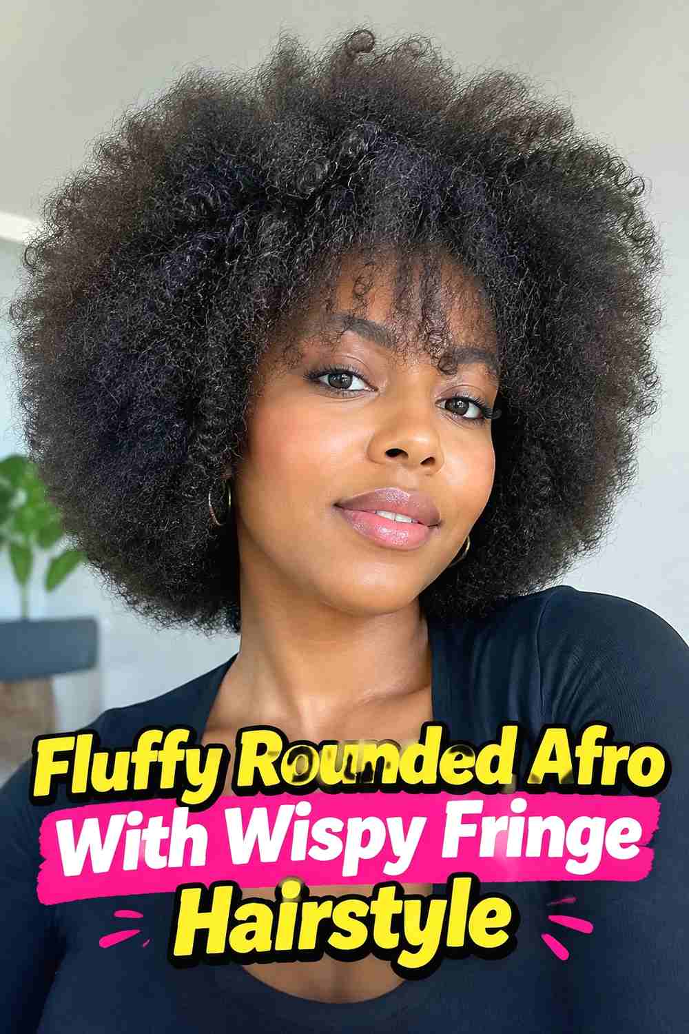 8. Fluffy Rounded Afro With Wispy Fringe Hairstyle