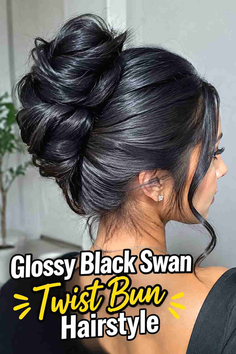 8. Glossy Black Swan Twist Bun Hairstyle