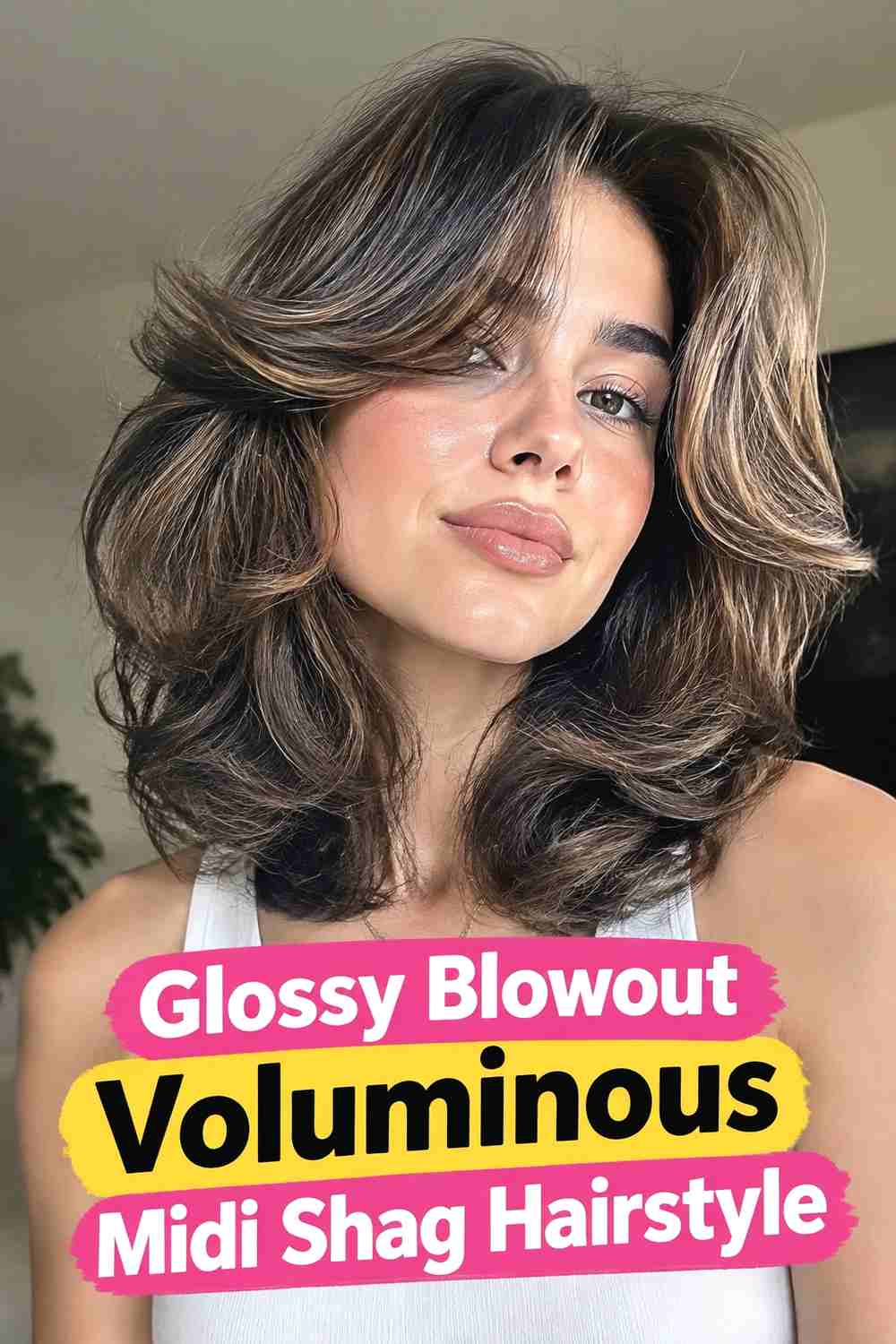 11. Glossy Blowout Voluminous Midi Shag Hairstyle