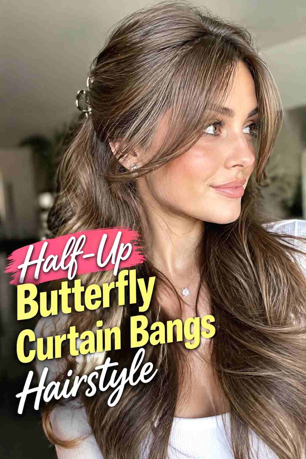 14. Half Up Butterfly Curtain Bangs Hairstyle