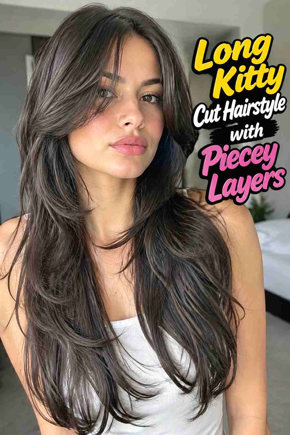 12. Long Kitty Cut Hairstyle With Piecey Layers