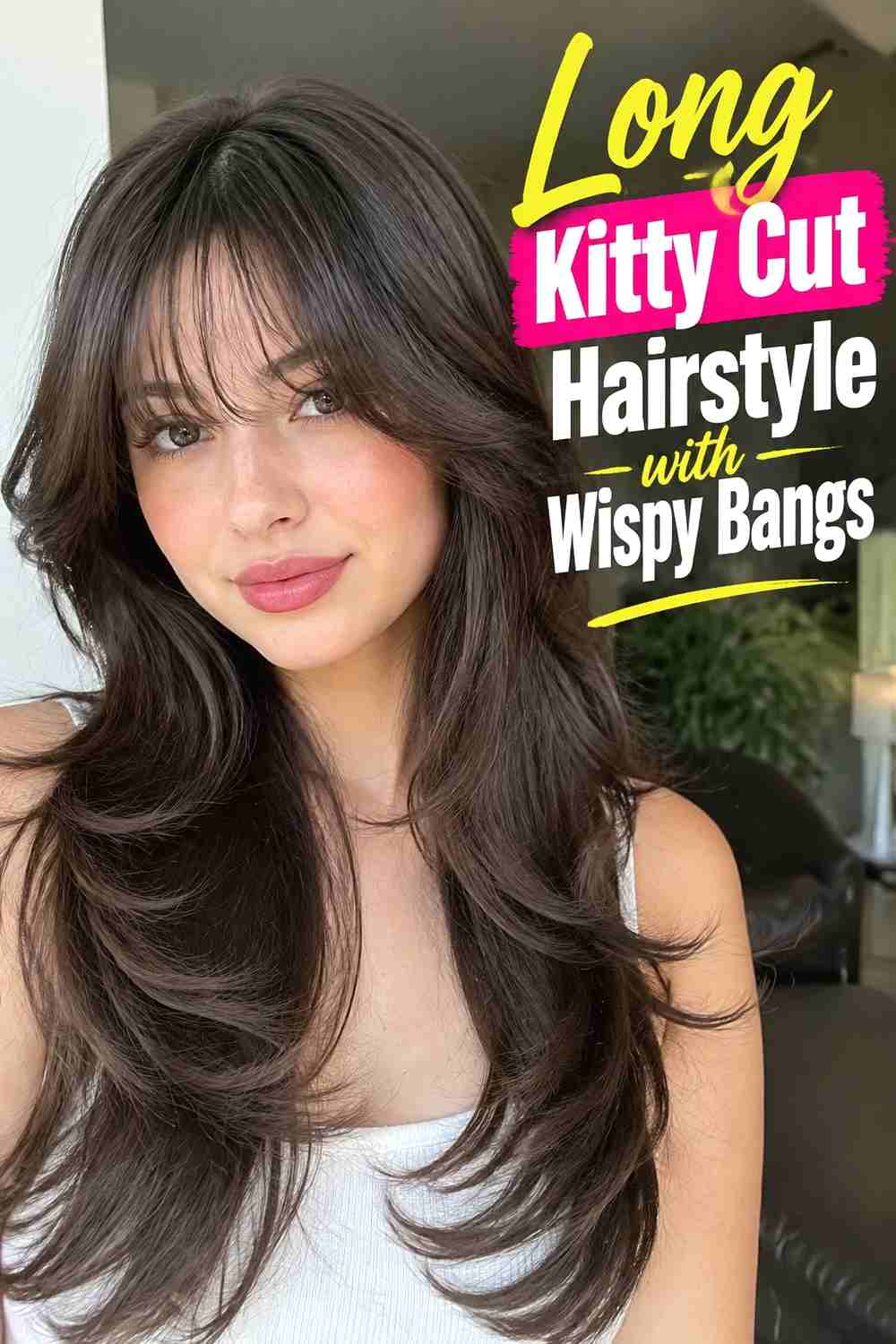8. Long Kitty Cut Hairstyle With Wispy Bangs