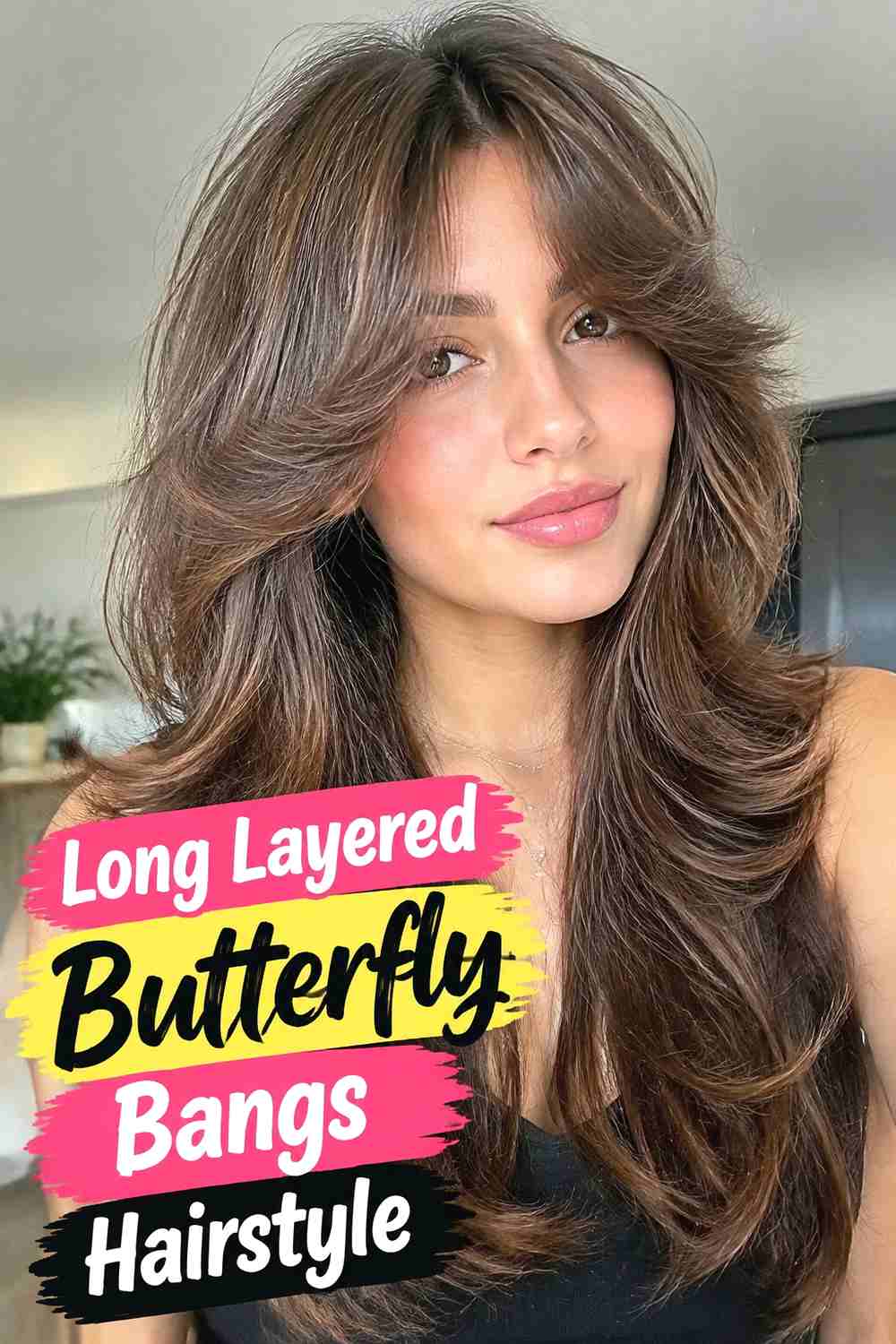2. Long Layered Butterfly Bangs Hairstyle