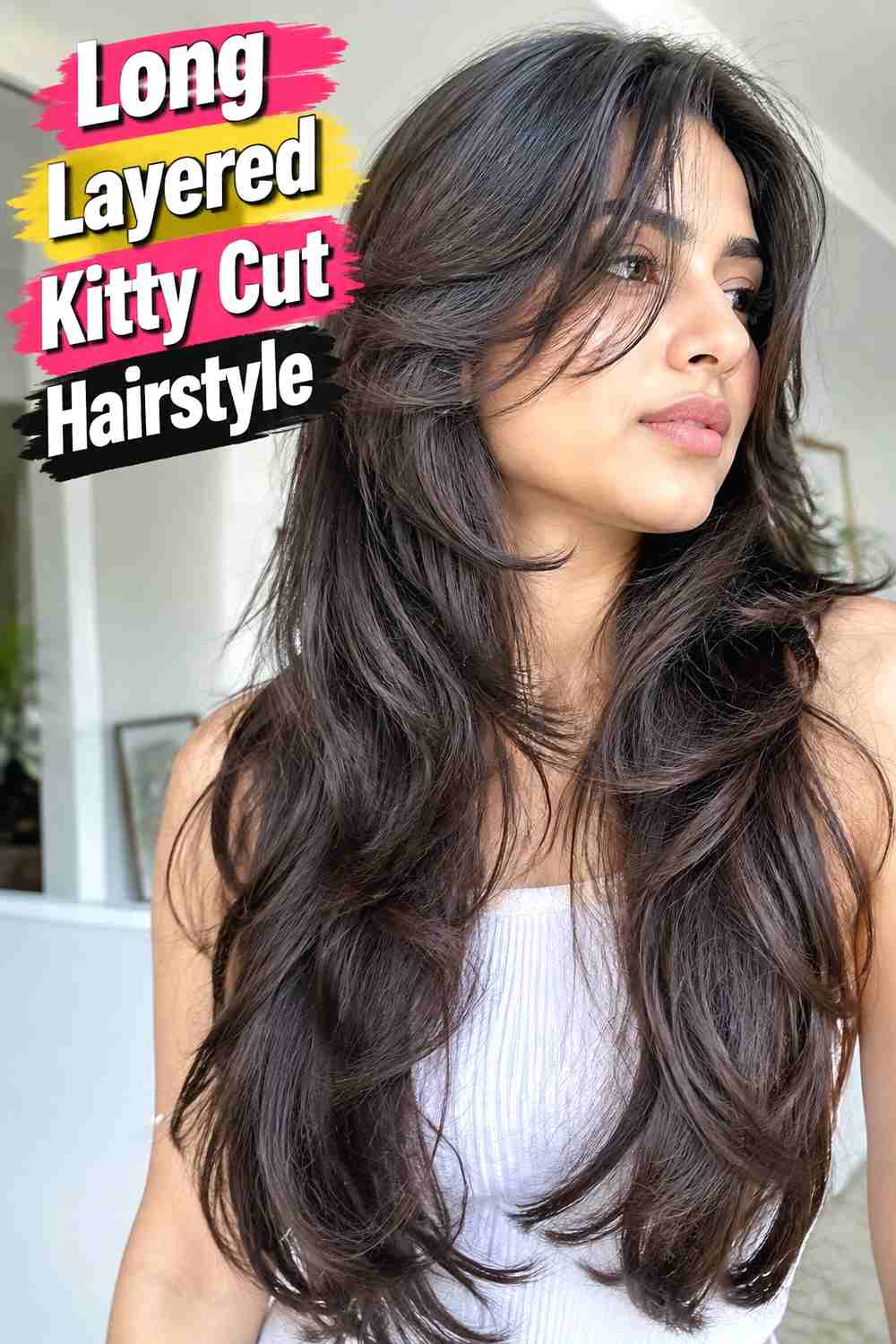 2. Long Layered Kitty Cut Hairstyle