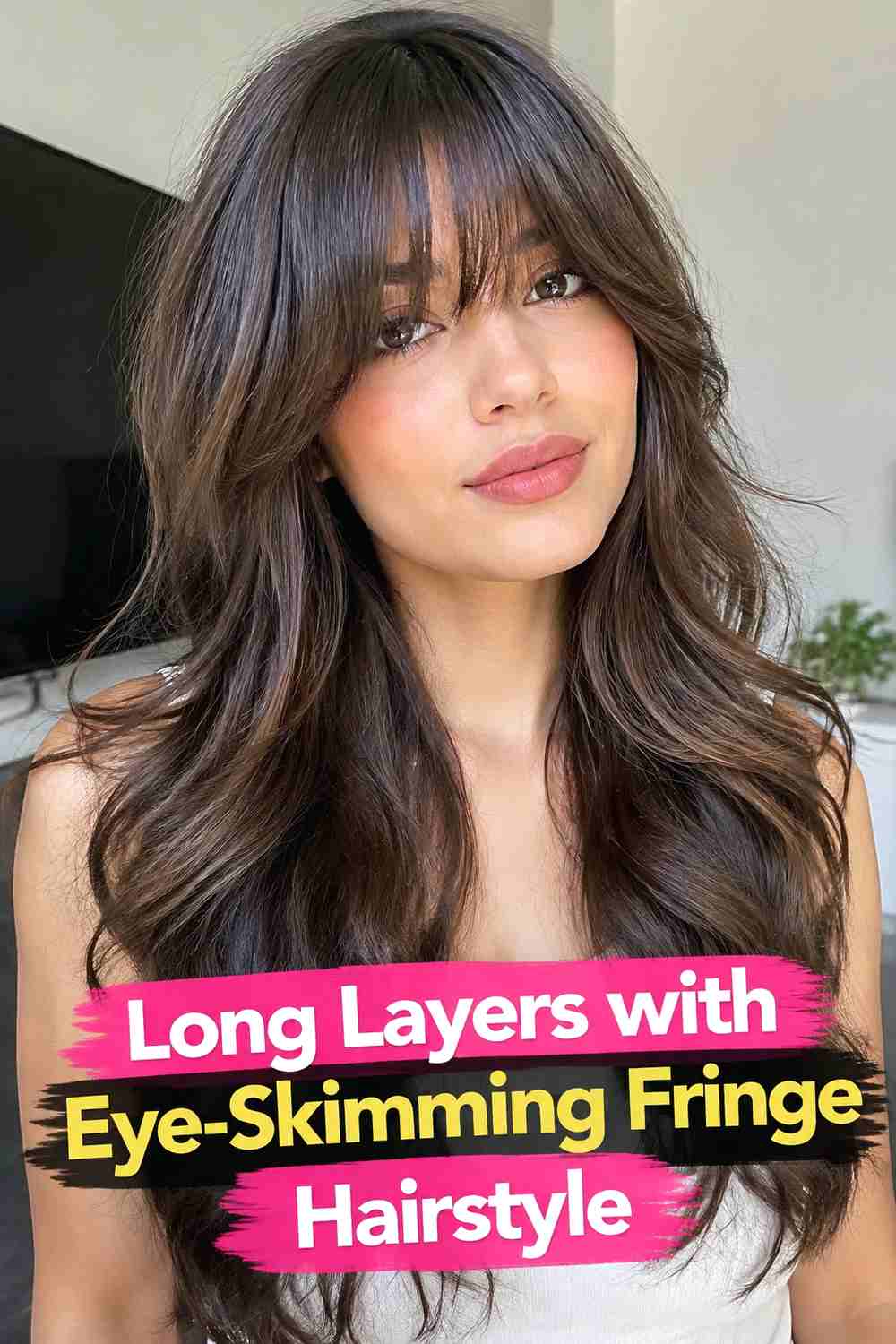 13. Long Layers With Eye Skimming Fringe Hairstyle