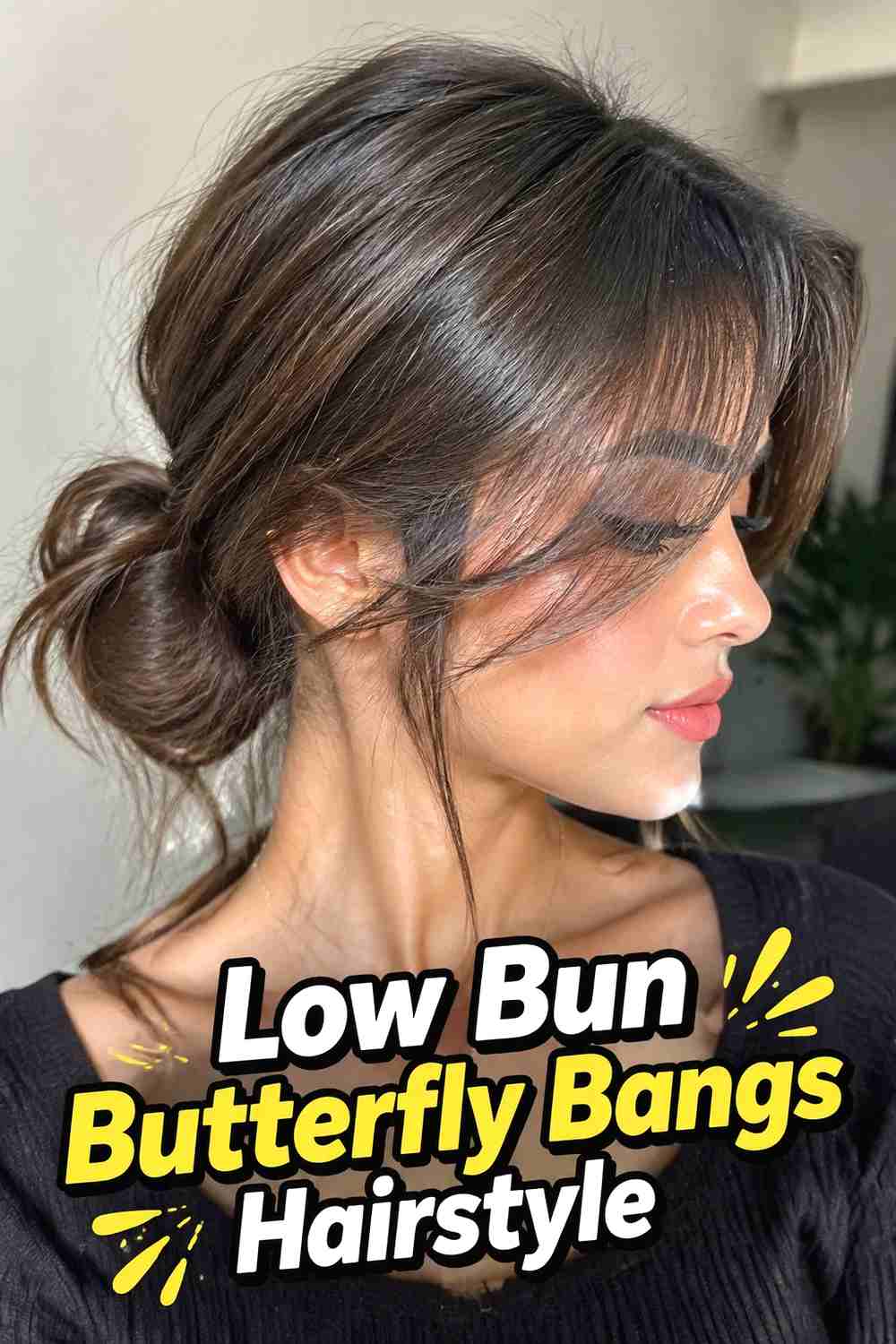 16. Low Bun Butterfly Bangs Hairstyle