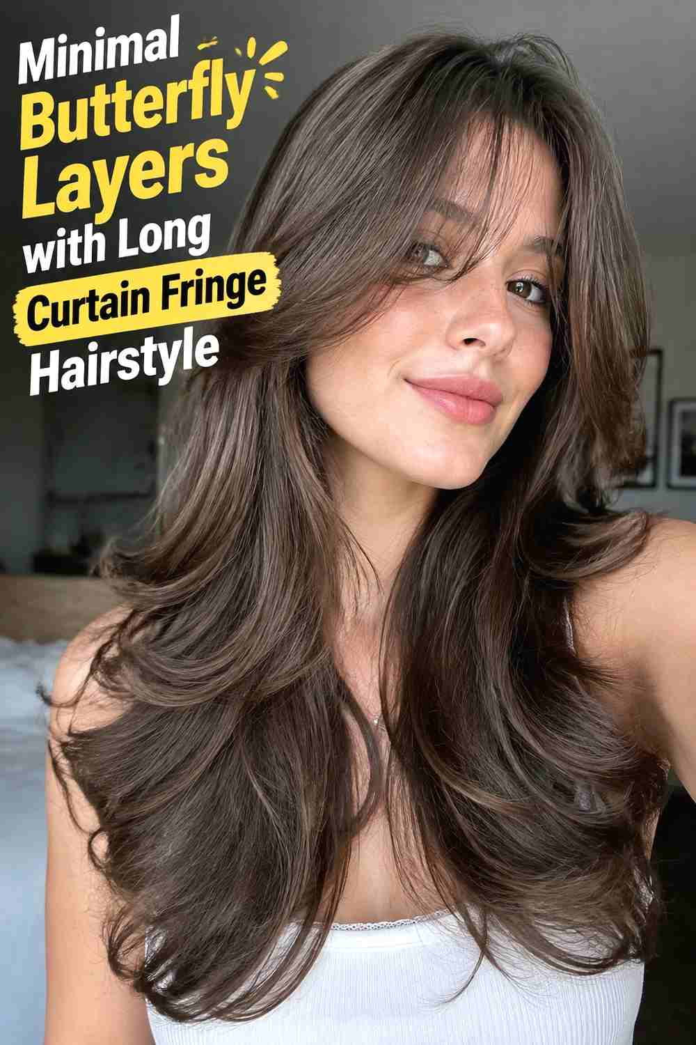 4. Minimal Butterfly Layers With Long Curtain Fringe Hairstyle