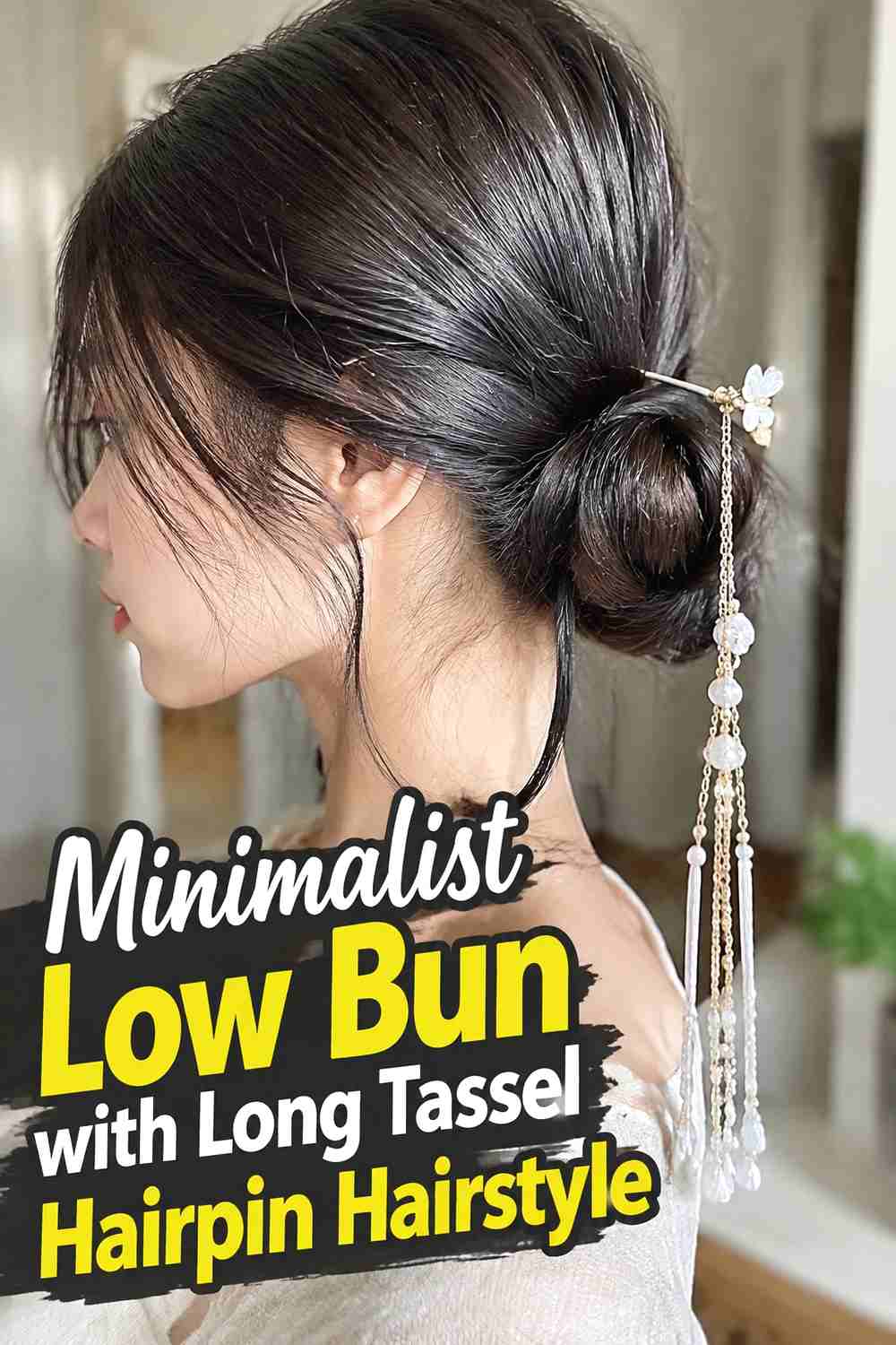 18. Minimalist Low Bun With Long Tassel Hairpin Hairstyle