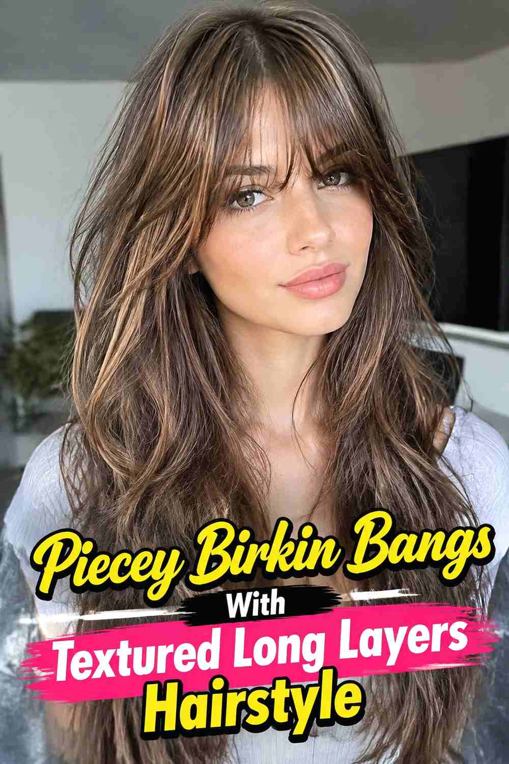 7. Piecey Birkin Bangs With Textured Long Layers Hairstyle