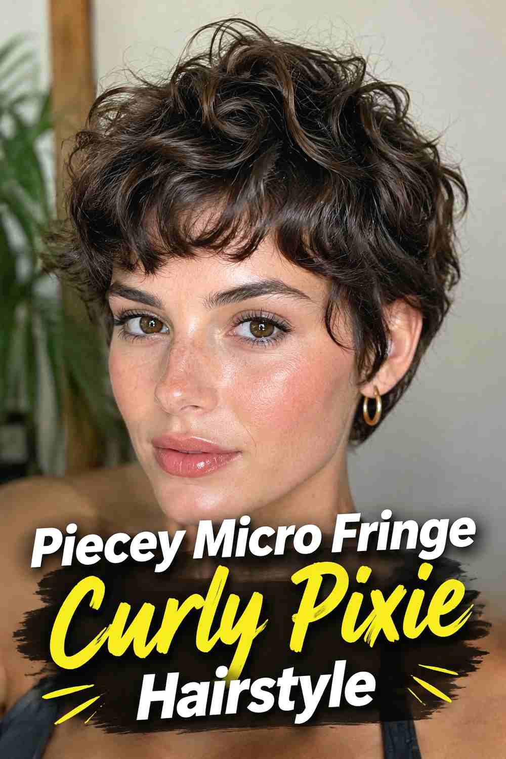 6. Piecey Micro Fringe Curly Pixie Hairstyle