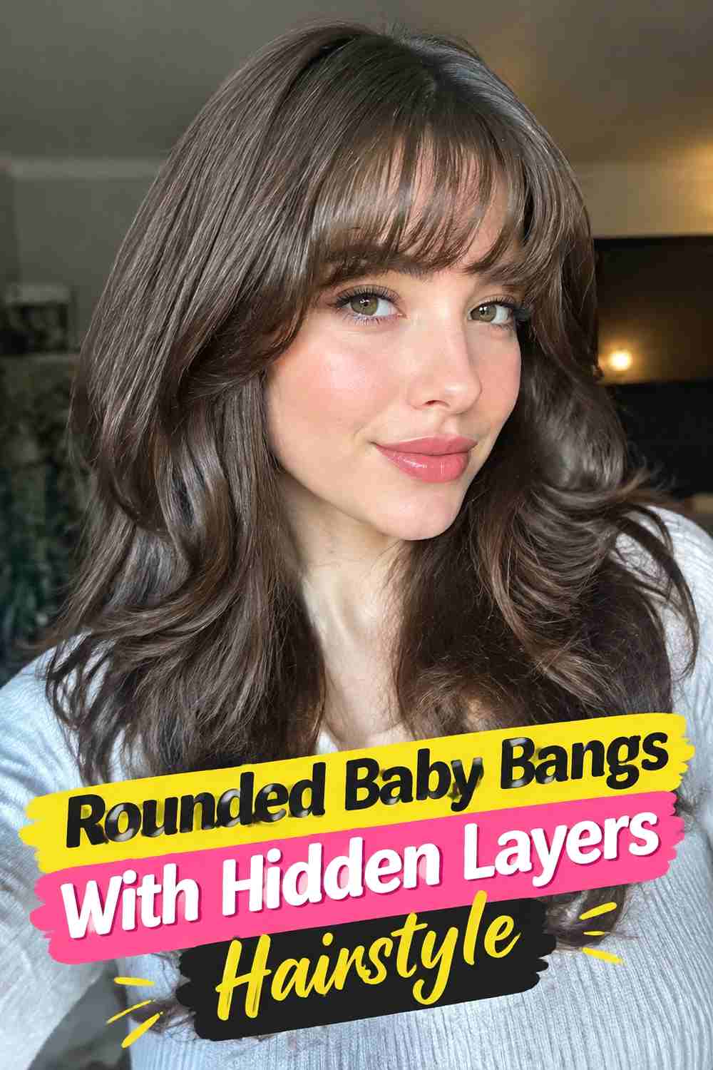 9. Rounded Baby Bangs With Hidden Layers Hairstyle