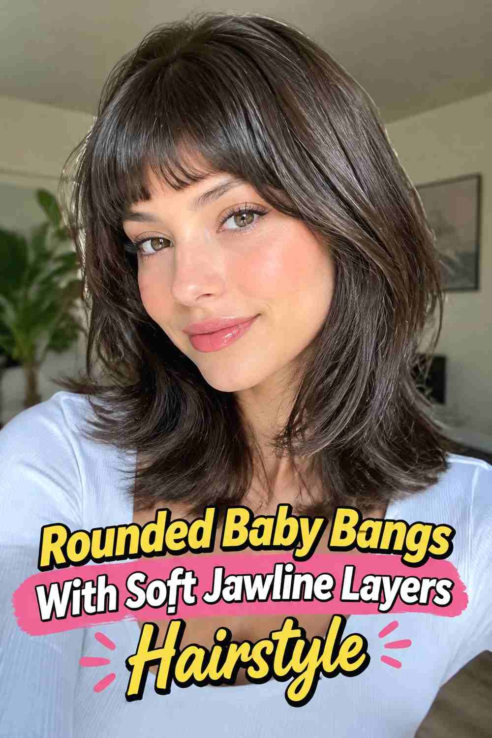 3. Rounded Baby Bangs With Soft Jawline Layers Hairstyle