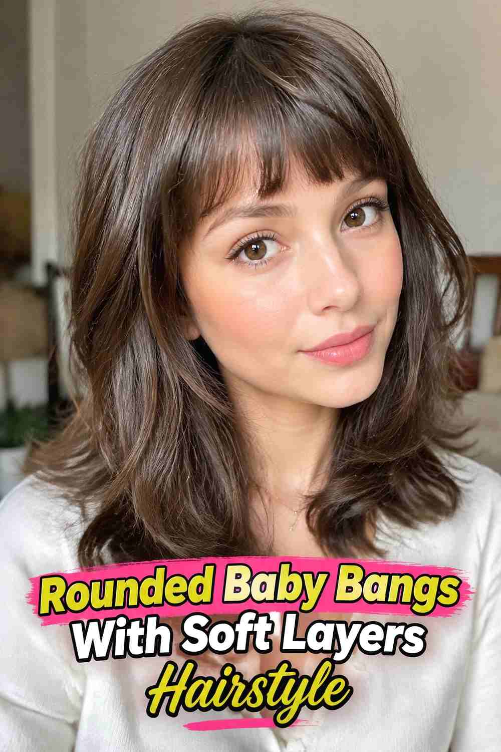 6. Rounded Baby Bangs With Soft Layers Hairstyle