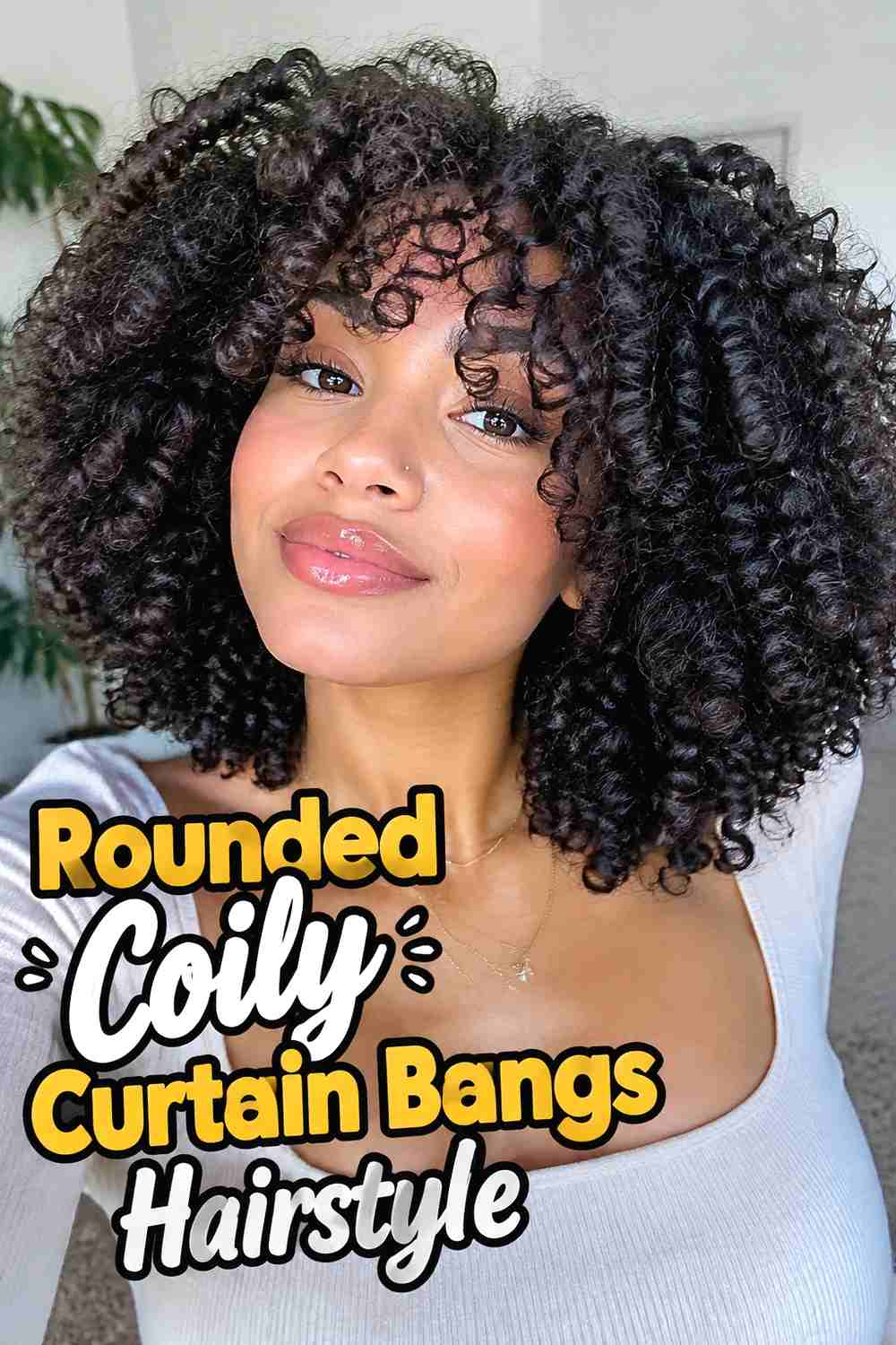 4. Rounded Coily Curtain Bangs Hairstyle