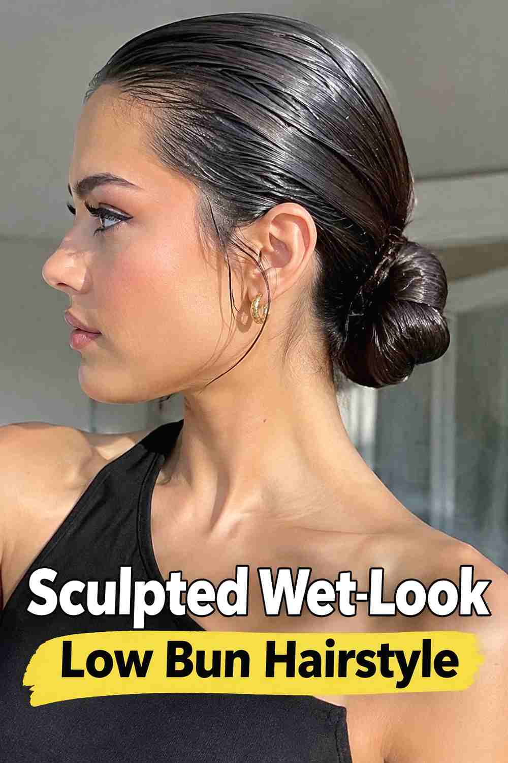 8. Sculpted Wet Look Low Bun Hairstyle