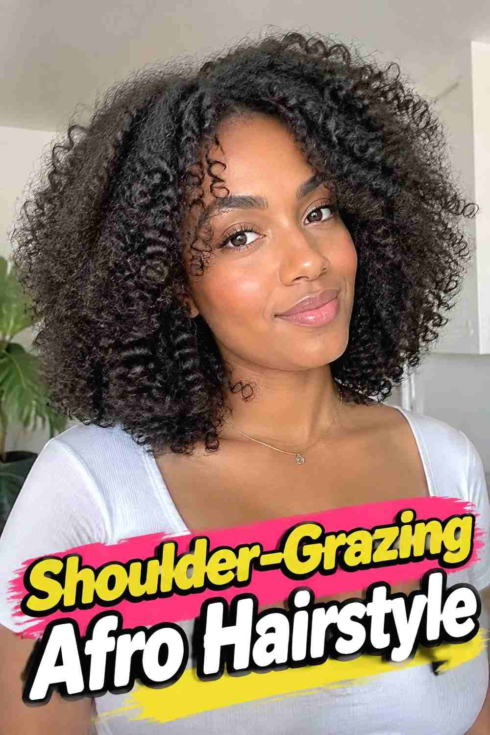 7. Shoulder Grazing Afro Hairstyle