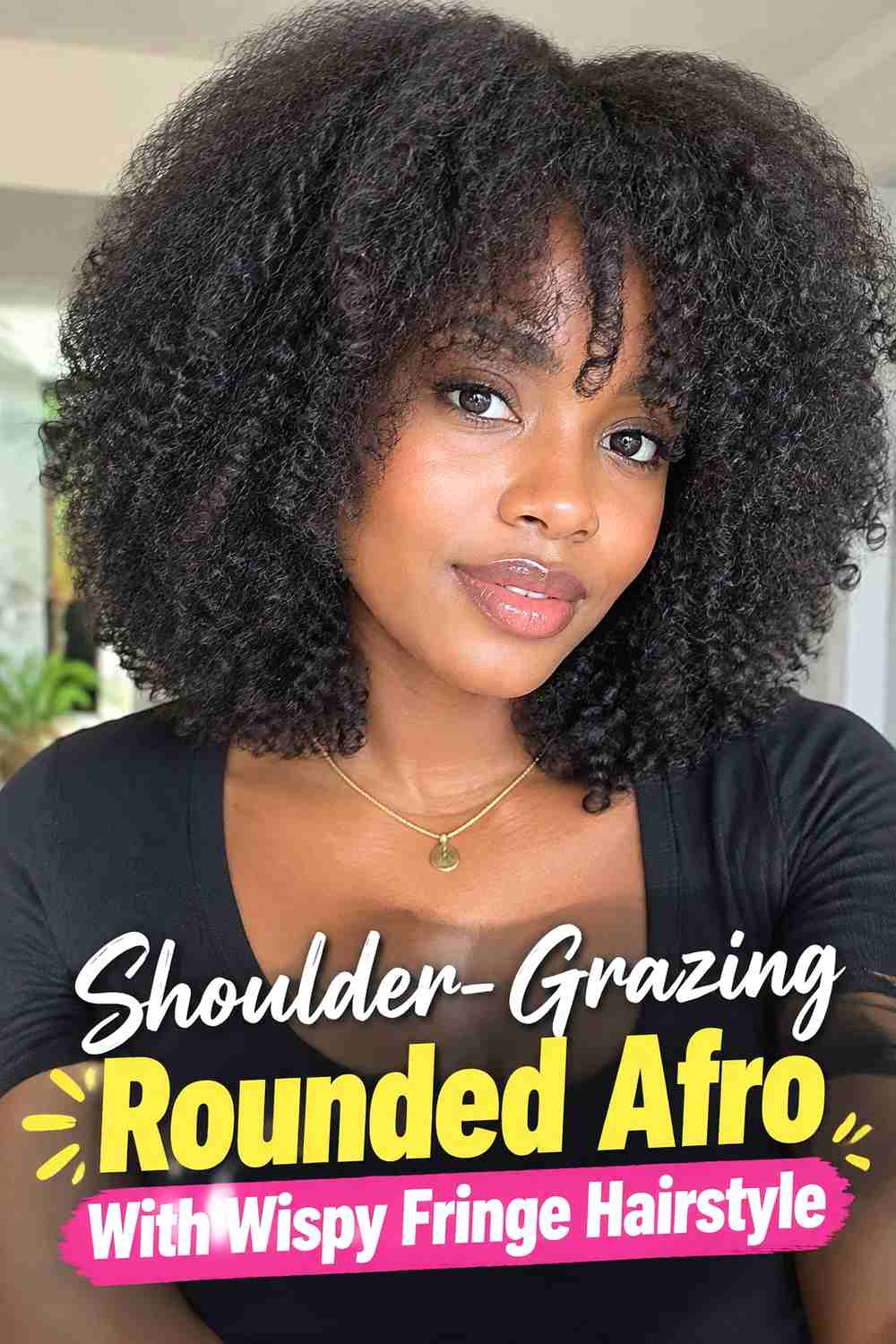 10. Shoulder Grazing Rounded Afro With Wispy Fringe Hairstyle