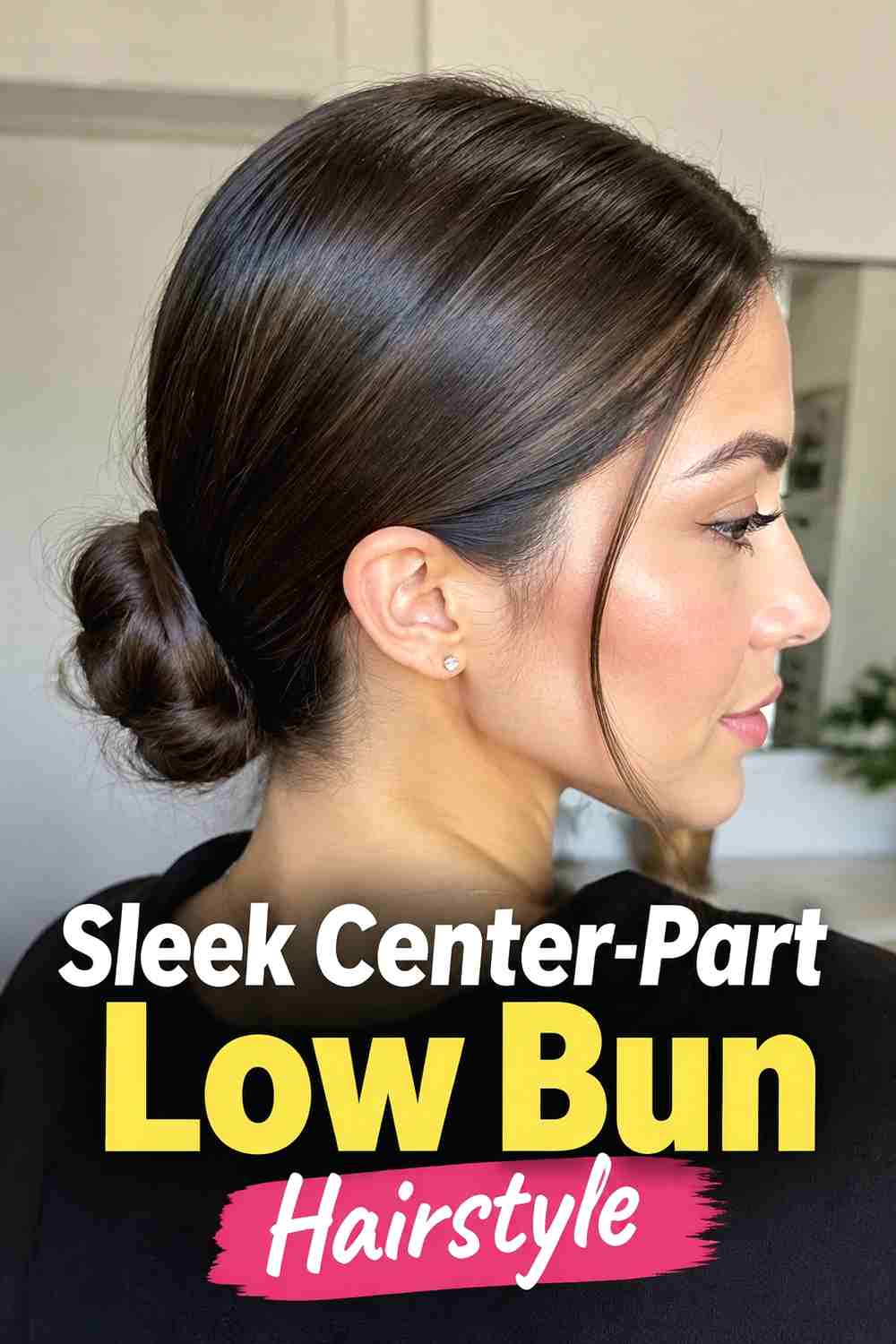14. Sleek Center Part Low Bun Hairstyle