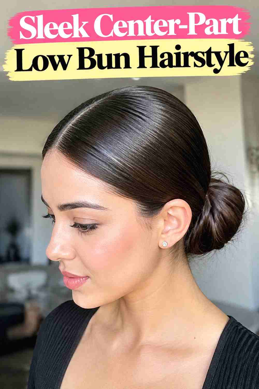 3. Sleek Center Part Low Bun Hairstyle