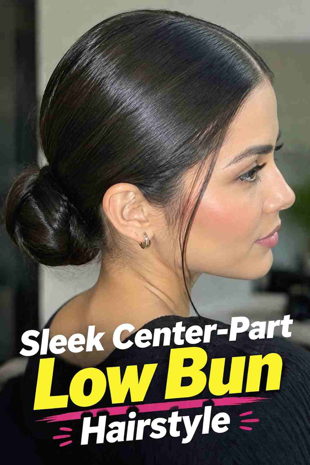 8. Sleek Center Part Low Bun Hairstyle