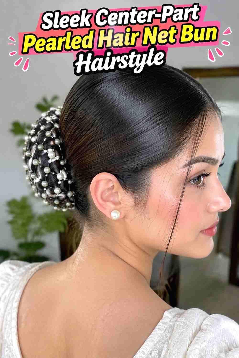 2. Sleek Center Part Pearled Hair Net Bun Hairstyle