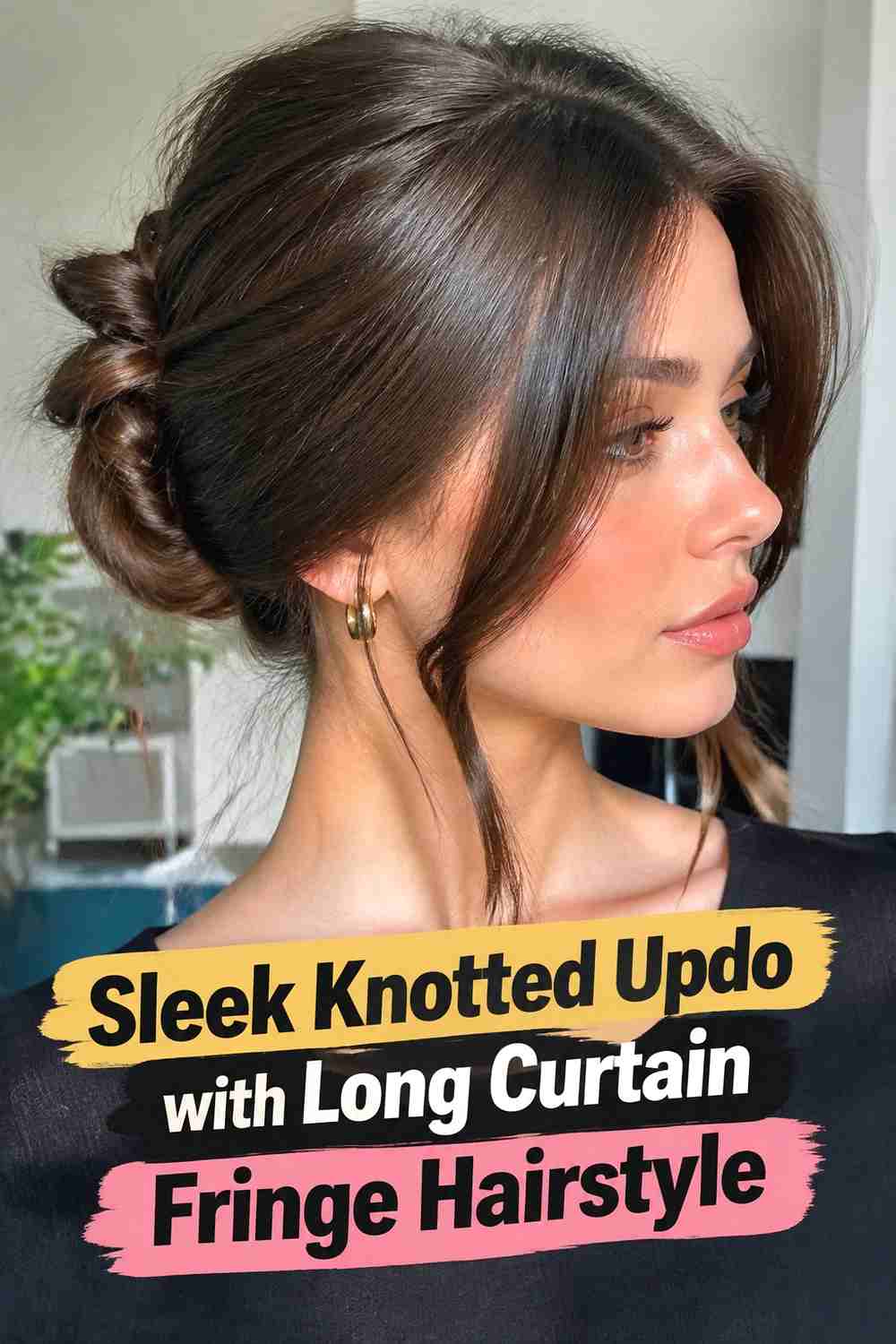 7. Sleek Knotted Updo With Long Curtain Fringe Hairstyle