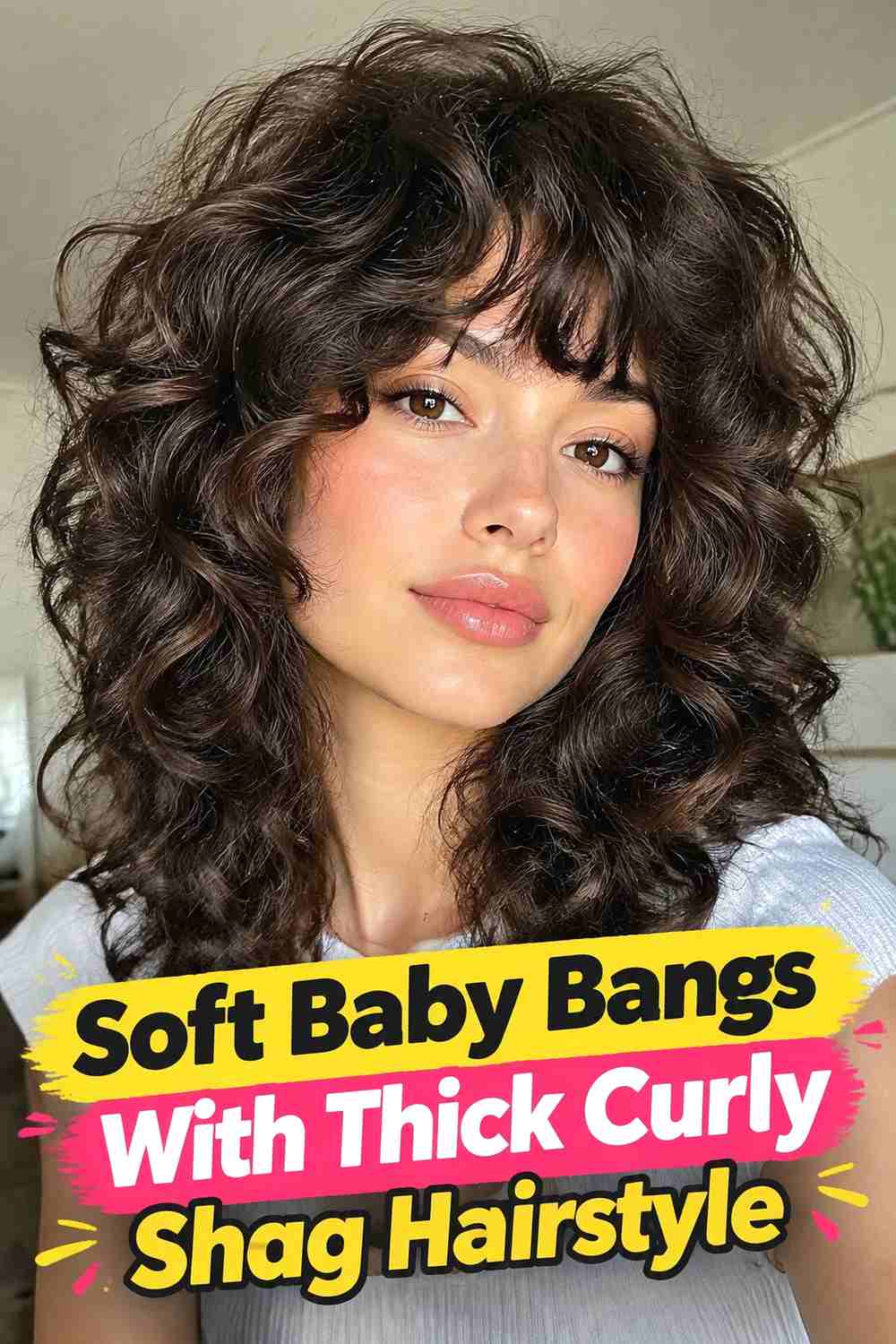 15. Soft Baby Bangs With Thick Curly Shag Hairstyle