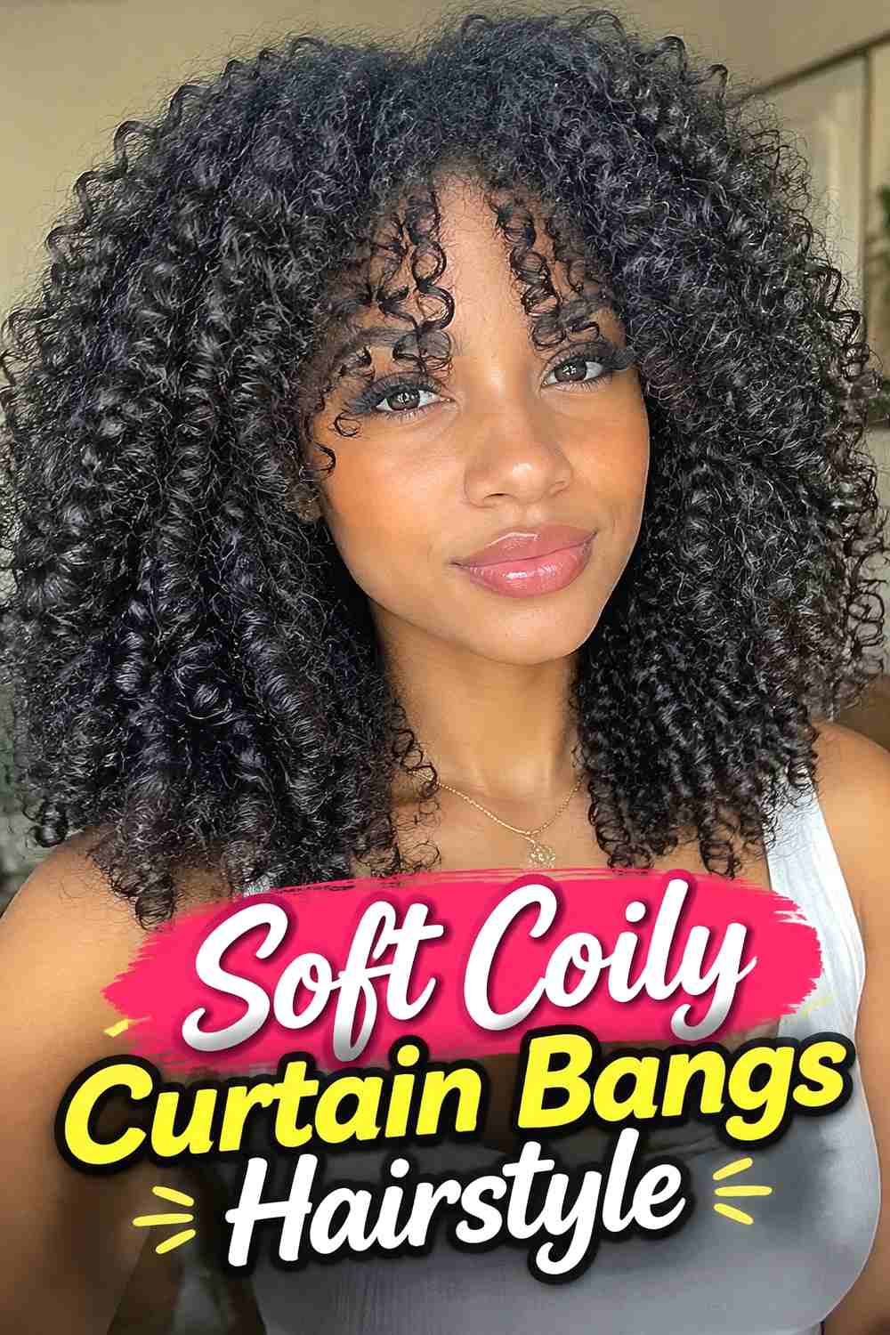 14. Soft Coily Curtain Bangs Hairstyle